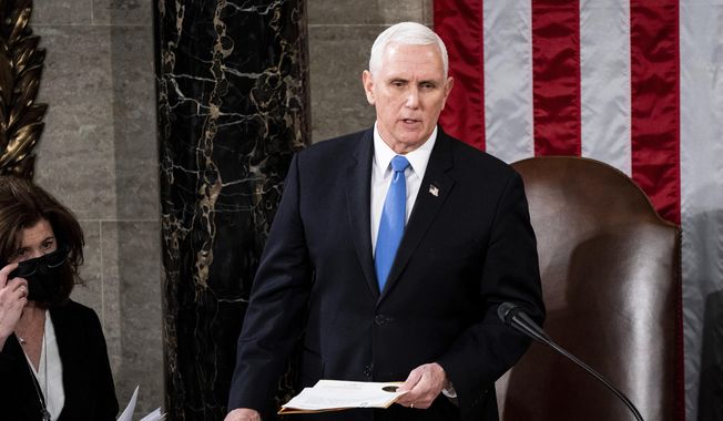 Vice President Mike Pence officiates as a joint session of the House and Senate convenes to confirm the Electoral College votes cast in November&#x27;s election, at the Capitol in Washington, Wednesday, Jan. 6, 2021. (Erin Schaff/The New York Times via AP, Pool, File)