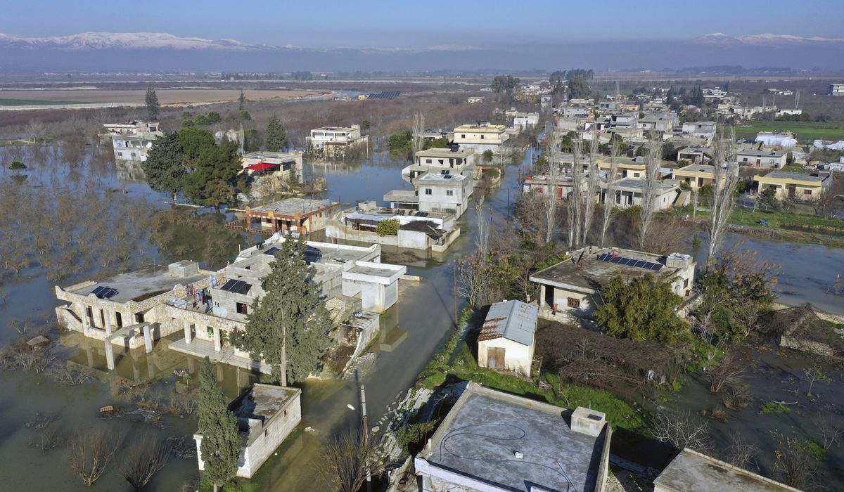 NextImg:Days after quake, aid trucks reach northwest Syrian enclave