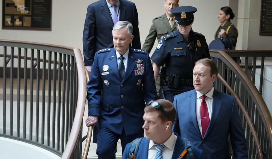 Lawmakers and intelligence advisers, including Gen. Glen VanHerck, left, commander of the United States Northern Command and North American Aerospace Defense Command, arrive for a closed briefing on the Chinese surveillance balloon that flew over the United States recently, at the Capitol in Washington, Thursday, Feb. 9, 2023. (AP Photo/J. Scott Applewhite)