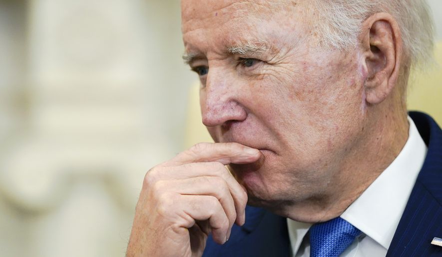 President Joe Biden listens during a meeting with Brazil's President Luiz Inacio Lula da Silva in the Oval Office of the White House, Friday, Feb. 10, 2023, in Washington. (AP Photo/Alex Brandon)