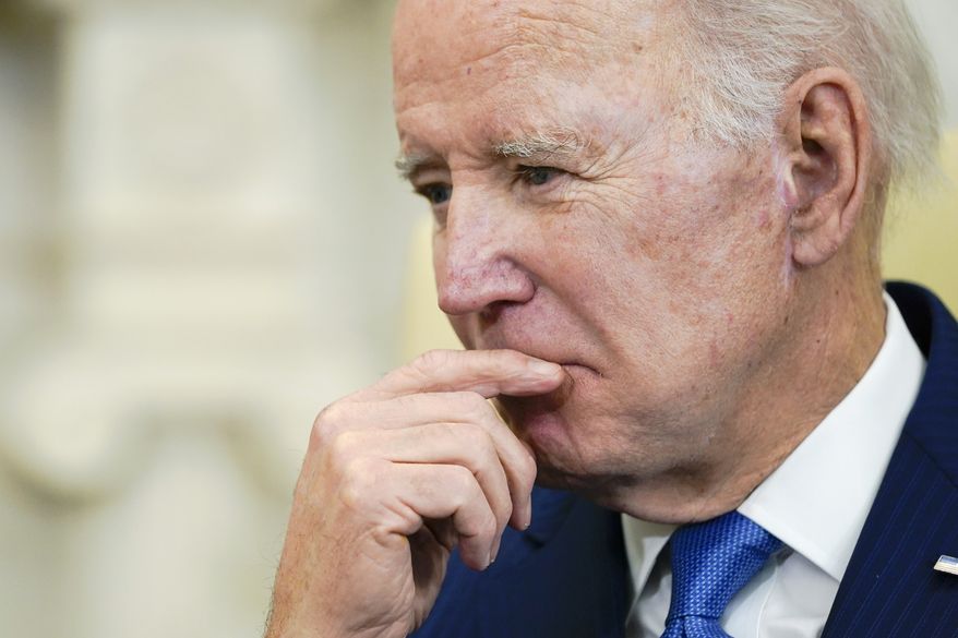 President Joe Biden listens during a meeting with Brazil's President Luiz Inacio Lula da Silva in the Oval Office of the White House, Friday, Feb. 10, 2023, in Washington. (AP Photo/Alex Brandon)