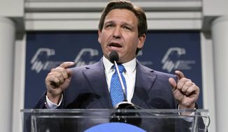 Florida Gov. Ron DeSantis speaks at an annual leadership meeting of the Republican Jewish Coalition on Nov. 19, 2022, in Las Vegas. DeSantis reiterated Monday, Jan. 23, 2023, that the state&#x27;s rejection of a proposed nationwide advanced African American studies course, saying it pushes a political agenda — something three authors cited in the state&#x27;s criticism accusing him of doing in return. (AP Photo/John Locher) **FILE**