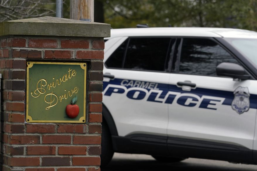 Carmel, Ind. police secure the entrance to the neighborhood of former Vice President Mike Pence's Indiana home, Friday, Feb. 10, 2023 in Carmel, Ind. The FBI is searching Pence's home as part of a classified records probe. That's according to a person familiar with the search who was not authorized to discuss it and spoke on condition of anonymity. (AP Photo/Michael Conroy)