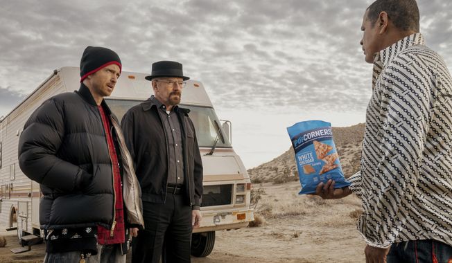 This photo provided by Frito-Lay shows Aaron Paul, Bryan Cranston and Raymond Cruz in scene from PopCorners 2023 Super Bowl NFL football spot. Big name advertisers are paying as much as $7 million for a 30-second spot during the big game on Sunday, Feb. 12, 2023. In order to get as much as a return on investment for those million, most advertisers release their ads in the days ahead of the big game to get the most publicity for their spots. (Frito-Lay via AP)