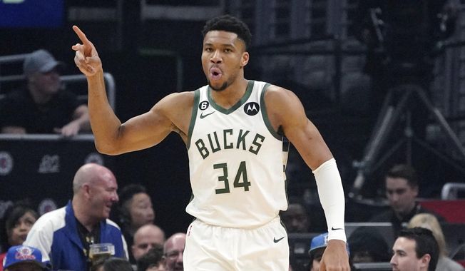 Milwaukee Bucks forward Giannis Antetokounmpo gestures after scoring during the first half of an NBA basketball game against the Los Angeles Clippers Friday, Feb. 10, 2023, in Los Angeles. (AP Photo/Mark J. Terrill)