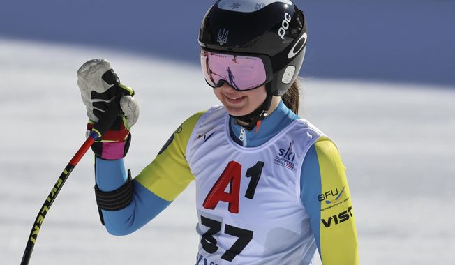 Ukraine&#x27;s Anastasiia Shepilenko waves at the finish area of an alpine ski, women&#x27;s World Championships super G, in Meribel, France, Wednesday, Feb. 8, 2023. (AP Photo/Marco Trovati)