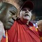 Kansas City Chiefs head coach Andy Reid, middle, and offensive coordinator Eric Bieniemy, left, celebrate victory over the Philadelphia Eagles after the NFL Super Bowl 57 football game, Sunday, Feb. 12, 2023, in Glendale, Ariz. The Kansas City Chiefs defeated the Philadelphia Eagles 38-35. (AP Photo/Brynn Anderson)