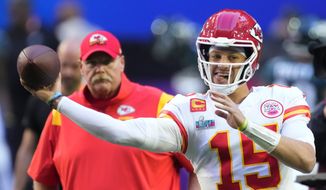 Kansas City Chiefs quarterback Patrick Mahomes (15) warms up as head coach Andy Reid looks on before the NFL Super Bowl 57 football game between the Kansas City Chiefs and the Philadelphia Eagles, Sunday, Feb. 12, 2023, in Glendale, Ariz. (AP Photo/Ross D. Franklin) **FILE**