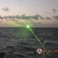 This photo provided by the Philippine Coast Guard shows a green military-grade laser light from a Chinese coast guard ship in the disputed South China Sea, Monday, Feb. 6, 2023. The Philippines on Monday, Feb. 13, accused a Chinese coast guard ship of hitting a Philippine coast guard vessel with a military-grade laser and temporarily blinding some of its crew in the disputed South China Sea, calling it a &quot;blatant&quot; violation of Manila&#x27;s sovereign rights. (Philippine Coast Guard via AP)