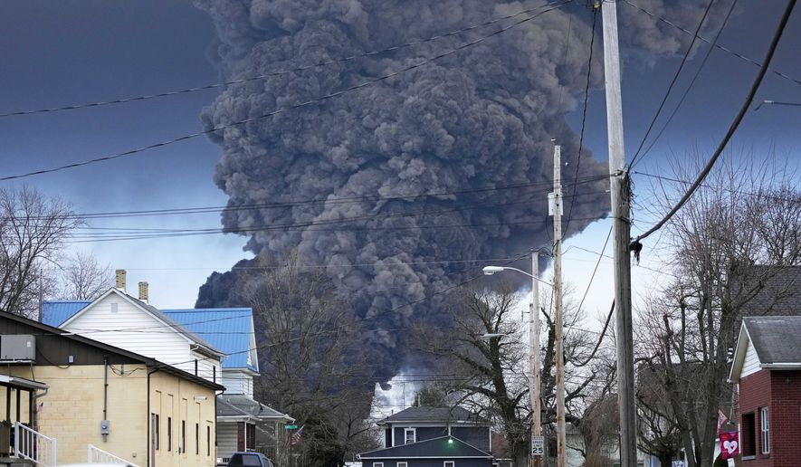 A black plume rises over East Palestine, Ohio, as a result of a controlled detonation of a portion of the derailed Norfolk Southern trains, Feb. 6, 2023. West Virginia&#x27;s water utility says it&#x27;s taking precautionary steps following the derailment of a train hauling chemicals that later sent up a toxic plume in Ohio. The utility said in a statement on Sunday, Feb. 16, 2023, that it has enhanced its treatment processes even though there hasn’t been a change in raw water at its Ohio River intake. (AP Photo/Gene J. Puskar, File)