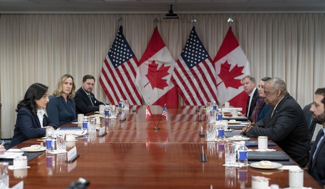 Secretary of Defense Lloyd Austin, right, meets with Canada&#x27;s Minister of National Defense Anita Anand, far left, at the Pentagon in Washington, Friday, Feb. 10, 2023. (AP Photo/J. Scott Applewhite)
