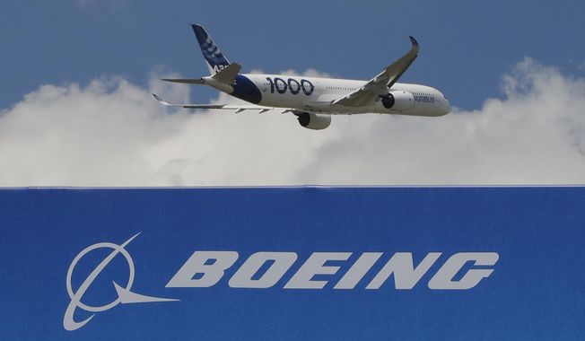 In this June 17, 2019, file photo, an Airbus A 350 - 1000 performs a demonstration flight at Paris Air Show in Le Bourget, east of Paris, France. The owner of Air India announced a deal Tuesday, Feb.14, 2023, to buy 250 Airbus jets, including A350 wide-body planes and A320neo single-aisle planes in a deal worth billions of dollars. Air India, owned by Tata Group, is reportedly considering a similar order for Boeing as part of expansion efforts. (AP Photo/Michel Euler, File)