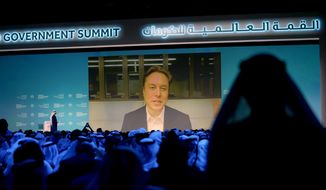 Elon Musk talks virtually to Mohammad Al Gergawi, UAE Minister of Cabinet Affairs, during the World Government Summit in Dubai, United Arab Emirates, Wednesday, Feb. 15, 2023. (AP Photo/Kamran Jebreili)