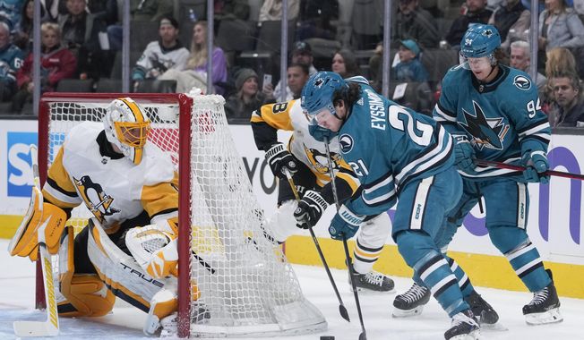 San Jose Sharks center Michael Eyssimont (21) prepares to shoot against Pittsburgh Penguins goaltender Casey DeSmith, left, during the first period of an NHL hockey game in San Jose, Calif., Tuesday, Feb. 14, 2023. (AP Photo/Godofredo A. Vásquez)