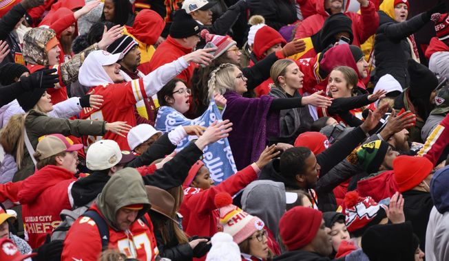 Fans do the tomahawk chop during the Kansas City Chiefs&#x27; victory celebration and parade in Kansas City, Mo., Wednesday, Feb. 15, 2023, following the Chiefs&#x27; win over the Philadelphia Eagles Sunday in the NFL Super Bowl 57 football game. (AP Photo/Reed Hoffmann)