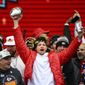 Kansas City Chiefs quarterback Patrick Mahomes and teammates react to the crowd during the Chiefs&#x27; victory celebration and parade in Kansas City, Mo., Wednesday, Feb. 15, 2023. The Chiefs defeated the Philadelphia Eagles Sunday in the NFL Super Bowl 57 football game. (AP Photo/Reed Hoffmann)