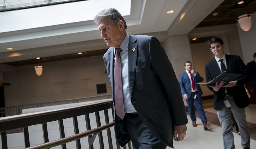 Sen. Joe Manchin, D-W.Va., arrives for a classified briefing on China, at the Capitol in Washington, Wednesday, Feb. 15, 2023. (AP Photo/J. Scott Applewhite)