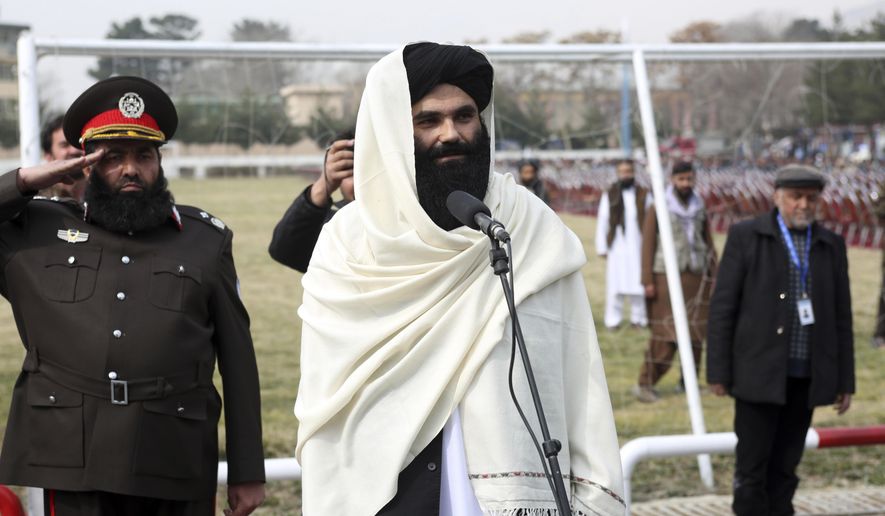 Taliban acting Interior Minister Sirajuddin Haqqani speaks during a graduation ceremony at the police academy in Kabul, Afghanistan, Saturday, March 5, 2022. A rare public show of division has arisen in the ranks of Afghanistan&#x27;s ruling Taliban. A senior Taliban figure publicly criticized the group&#x27;s leadership in a speech, accusing some of monopolizing power. The comments by Interior Minister Sirajuddin Haqqani were seen as directed at the Taliban&#x27;s supreme leader, Haibatullah Akhundzada. (AP Photo, File)