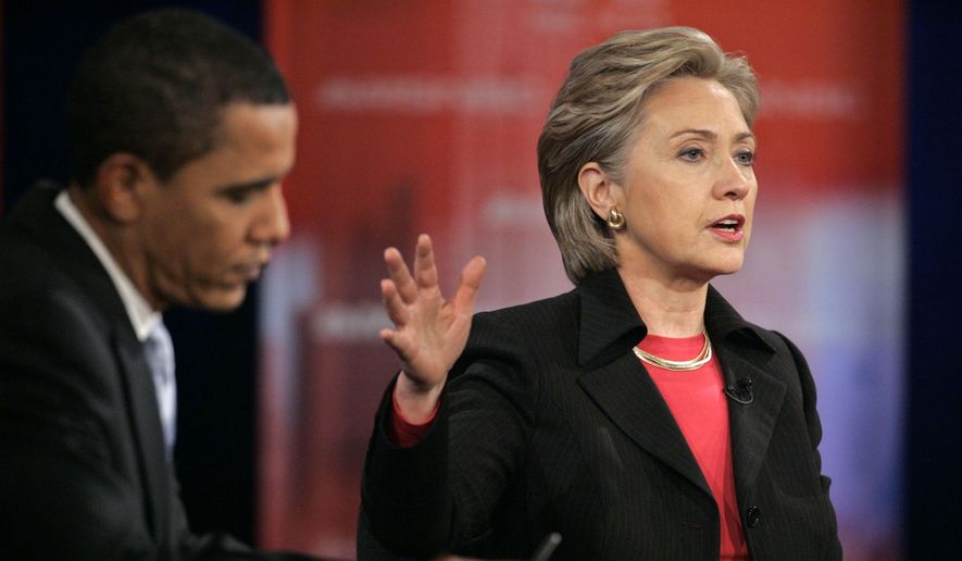 Democratic presidential candidates then-Sen. Hillary Clinton, D-N.Y., right, speaks as then-Sen. Barack Obama, D-Ill., listens during a Democratic presidential debate in Las Vegas, Jan. 15, 2008. (AP Photo/Jae C. Hong, File)