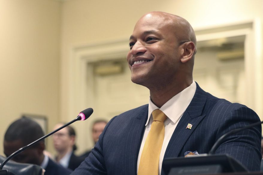Maryland Gov. Wes Moore greets state lawmakers on the House Ways and Means Committee before testifying in favor of his proposal to expand state tax relief for military retirees at a hearing on Thursday, Feb. 16, 2023 in Annapolis, Md. (AP Photo/Brian Witte)