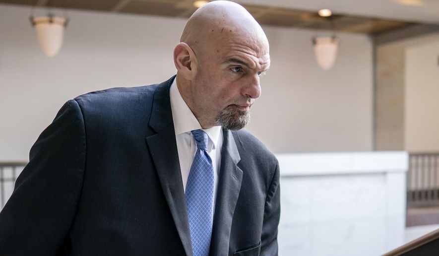 Sen. John Fetterman, D-Pa., leaves an intelligence briefing on the unknown aerial objects the U.S. military shot down this weekend at the Capitol in Washington, Feb. 14, 2023. Fetterman is in Walter Reed National Military Medical Center to seek treatment for clinical depression. His office said Thursday that Fetterman checked himself in Wednesday night. (AP Photo/J. Scott Applewhite, File)