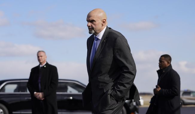 Sen. John Fetterman, D-Pa., walks to a motorcade vehicle after stepping off Air Force One behind President Joe Biden, Feb. 3, 2023, at Philadelphia International Airport in Philadelphia. On Thursday, Feb. 16, Fetterman&#x27;s office announced that the senator had checked himself into the hospital for clinical depression. (AP Photo/Patrick Semansky, File)