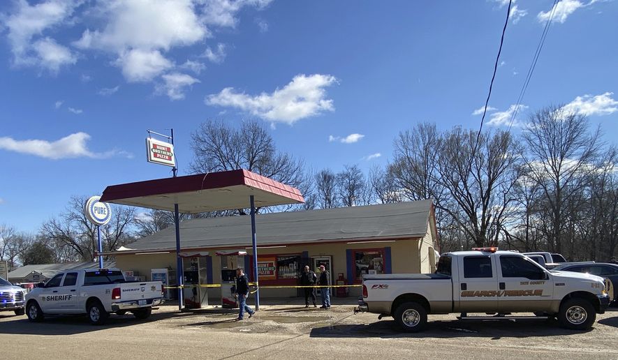 Law enforcement personnel work at the scene of a shooting, Friday, Feb. 17, 2023, in Arkabutla, Miss. Six people were fatally shot Friday in the small town in rural Mississippi near the Tennessee state line, and authorities said they had taken a suspect into custody. (Adam Itayem/NewsNation via AP)