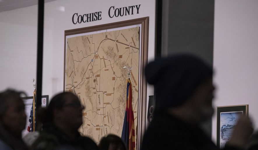 Members of the public attend Cochise County Board of Supervisors meeting to provide feedback on the proposed transfer of election functions and duties to the county recorder, Tuesday, Feb. 14, 2023, in Bisbee, Ariz. (AP Photo/Alberto Mariani)
