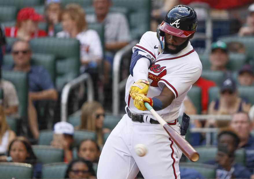 Atlanta Braves&#x27; Michael Harris II, making his major-league debut, hits his first major league hit, a single in the sixth inning of a baseball game against the Miami Marlins, on May 28, 2022, in Atlanta. Harris II — whose call up last year propelled the Braves to 101 wins and a division title — said Saturday he “had an all right season, I guess” and then responded with more modesty when asked if that&#x27;s really how he feels about 2022. (AP Photo/Bob Andres, FIle)