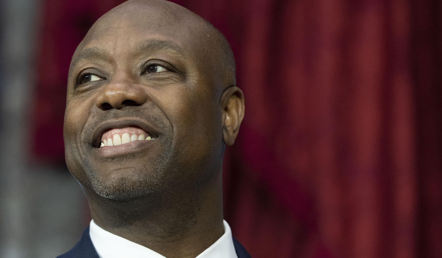 Sen. Tim Scott, R-S.C., participates in his ceremonial swearing-in by Vice President Kamala Harris, in the Old Senate Chamber on Capitol Hill in Washington, Jan. 3, 2023. Scott is speaking at an event at Drake University on Wednesday, Feb. 22, as part of what aides call a national listening tour aimed at informing his plans, before addressing the annual Polk County Republican fundraiser in suburban Des Moines that evening. (AP Photo/Jacquelyn Martin, File)