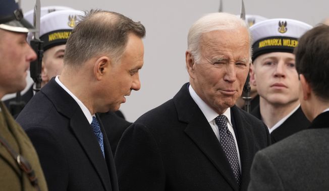Polish President Andrzej Duda, left, welcomes President Joe Biden at the Presidential Palace in Warsaw, Ukraine, Tuesday, Feb. 21, 2023. Biden is visiting Poland a day after an unannounced visit to Kyiv to meet President Volodymyr Zelenskyy, that comes days before the first anniversary of Russia&#x27;s invasion of Ukraine. (AP Photo/Czarek Sokolowski)