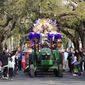 Queen of Zulu Dr. Christy Lagarde Spears rides on a float during the traditional Krewe of Zulu Parade on Mardi Gras Day in New Orleans, Tuesday, Feb. 21, 2023. (AP Photo/Gerald Herbert)
