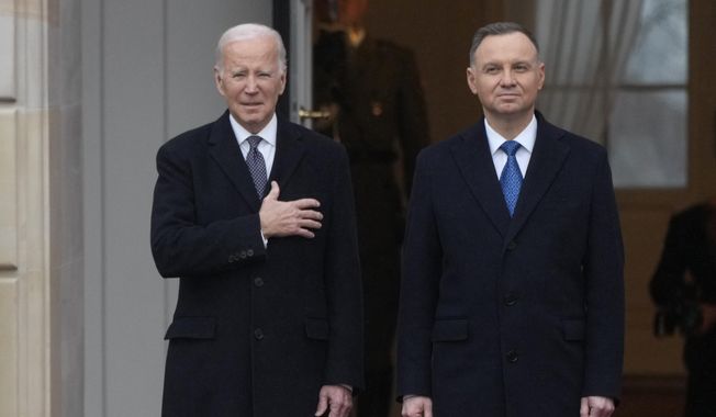 Polish President Andrzej Duda, right, welcomes President Joe Biden at the Presidential Palace in Warsaw, Ukraine, Tuesday, Feb. 21, 2023. Biden is visiting Poland a day after an unannounced visit to Kyiv to meet President Volodymyr Zelenskyy, that comes days before the first anniversary of Russia&#x27;s invasion of Ukraine. (AP Photo/Czarek Sokolowski)