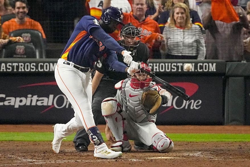 Houston Astros' Yordan Alvarez hits a three-run home run during the sixth inning in Game 6 of baseball's World Series against the Philadelphia Phillies on Saturday, Nov. 5, 2022, in Houston. Astros All-Star Yordan Alvarez has a sore hand that will keep him out of batting practice in the first few days of spring training. Alvarez told reporters on Tuesday soreness in the hand was an issue at times in the 2022 season and continued to “flare up a bit at times” during the offseason. (AP Photo/Sue Ogrocki, File)