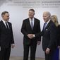 President Joe Biden is greeted by from left, Polish President Andrzej Duda, Romania President Klaus Werner Iohannis, Biden, and Slovakia President Suzana Caputova, right, as he arrives, Wednesday, Feb. 22, 2023, at the Presidential Palace in Warsaw, for talks with leaders from the Bucharest Nine, a collection of nations on the most eastern parts of the NATO alliance that came together in response to Russian President Vladimir Putin&#x27;s 2014 annexation of Crimea from Ukraine. (AP Photo/ Evan Vucci)