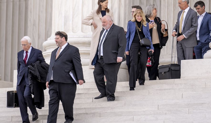 Attorney Eric Schnapper, a lawyer for Alassaf&#x27;s relatives, left, and Attorney Seth Waxman, representing Twitter, second from right, walk out of the Supreme Court building, Wednesday, Feb. 22, 2023 in Washington, after the Supreme Court heard oral arguments in Twitter v. Taamneh,  which will decide whether social media companies can be sued for aiding and abetting a specific act of international terrorism when the platforms have hosted user content that expresses general support for the group behind the violence without referring to the specific terrorist act in question.  (AP Photo/Andrew Harnik)