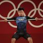 Igor Son of Kazakhstan competes in the men&#x27;s 61kg weightlifting event, at the 2020 Summer Olympics, on July 25, 2021, in Tokyo, Japan. The Weightlifting Federation of the Republic of Kazakhstan (WFRK) said Wednesday, Feb. 22, 2023, that Igor Son, who won the bronze in the men&#x27;s 61-kilogram category in Tokyo, was among six weightlifters from the country to receive doping bans. It was first reported in March 2022 that they had tested positive in samples taken by Kazakhstan&#x27;s anti-doping authorities. It&#x27;s the second career doping ban for Son, who served a seven-month sanction in 2015. The WFRK said the positive test would not lead to Son being stripped of his Olympic medal. (AP Photo/Luca Bruno)