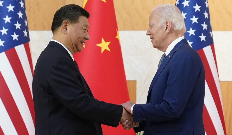FILE - U.S. President Joe Biden, right, and Chinese President Xi Jinping shake hands before their meeting on the sidelines of the G20 summit meeting, Nov. 14, 2022, in Nusa Dua, in Bali, Indonesia. Just 40% of U.S. adults approve of how President Joe Biden is handling relations with China, a new poll shows, with a majority anxious about Beijing&#x27;s influence as the White House finds its agenda increasingly shaped by global rivalries. (AP Photo/Alex Brandon, File)