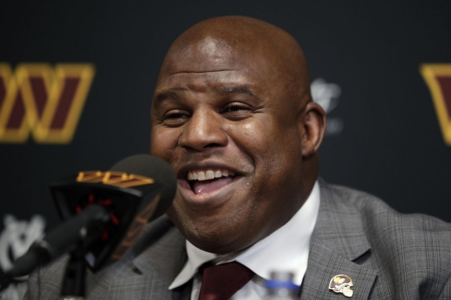 Eric Bieniemy talks after be introduced as the new offensive coordinator and assistant head coach of the Washington Commanders during an NFL football press conference in Ashburn, Va., Thursday, Feb. 23, 2023. (AP Photo/Luis M. Alvarez)
