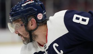 Washington Capitals left wing Alex Ovechkin wears a helmet bearing a sticker in memory of his father, Mikhail Ovechkin, in the first period of an NHL hockey game against the Anaheim Ducks, Thursday, Feb. 23, 2023, in Washington. Mikhail Ovechkin died Wednesday, Feb. 15, 2023, at age 71. (AP Photo/Patrick Semansky) **FILE**