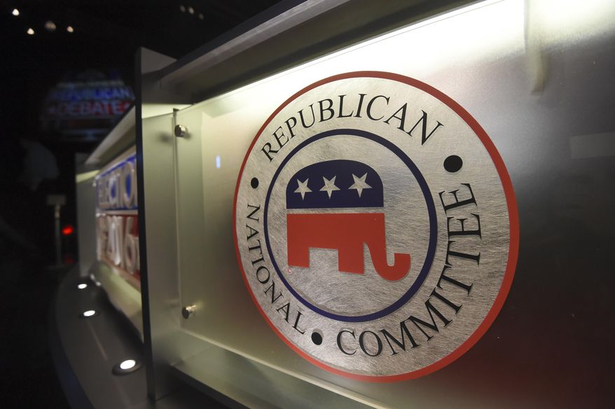 FILE - The Republican National Committee logo is shown on the stage as crew members work at the North Charleston Coliseum, Jan. 13, 2016, in North Charleston, S.C., in advance of Fox Business Network Republican presidential debate. The opening Republican presidential debate of the 2024 election season will take place in Milwaukee this August, the Republican National Committee decided Thursday, Feb. 23, 2023. (AP Photo/Rainier Ehrhardt, File)