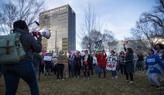 People gather in front of the J. Marvin Jones Federal Building and Mary Lou Robinson United States Courthouse to protest a lawsuit to ban the abortion drug mifepristone Saturday, Feb. 11, 2023, in Amarillo, Texas. (AP Photo/Justin Rex)