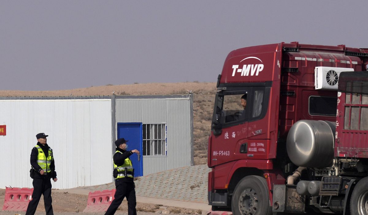 NextImg:Workers dig by layers in search for 47 missing at China mine