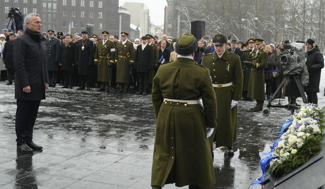 NATO Secretary-General Jens Stoltenberg attends a wreath-laying ceremony at the Monument to the War of Independence, on Freedom Square in Tallinn, Estonia, Friday, Feb. 24, 2023, during celebrations of the 105th anniversary of the Republic of Estonia. (AP Photo/Sergei Grits)