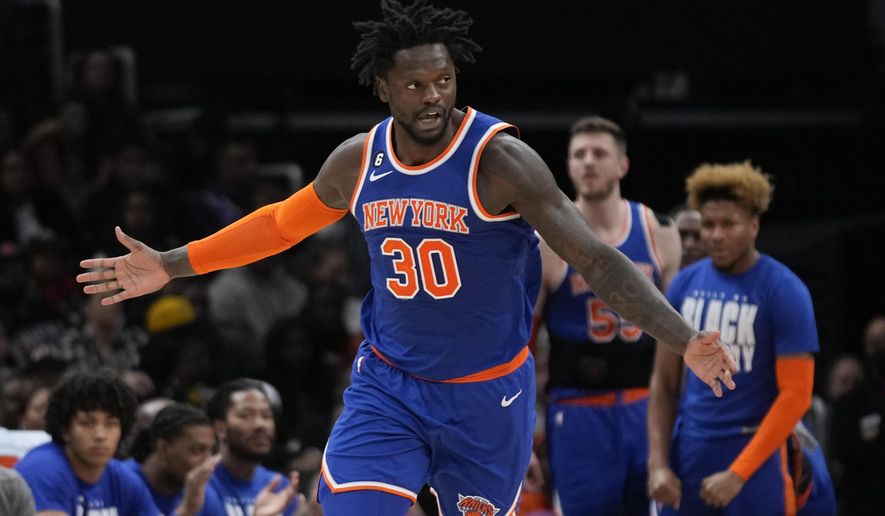 New York Knicks forward Julius Randle gestures after dunking on the Washington Wizards in the first half of an NBA basketball game, Friday, Feb. 24, 2023, in Washington. (AP Photo/Patrick Semansky)