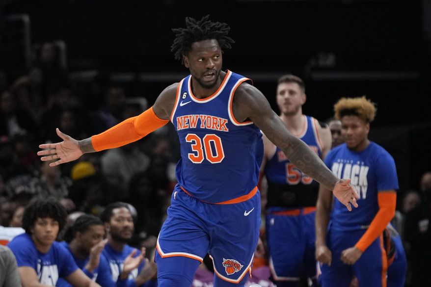 New York Knicks forward Julius Randle gestures after dunking on the Washington Wizards in the first half of an NBA basketball game, Friday, Feb. 24, 2023, in Washington. (AP Photo/Patrick Semansky)