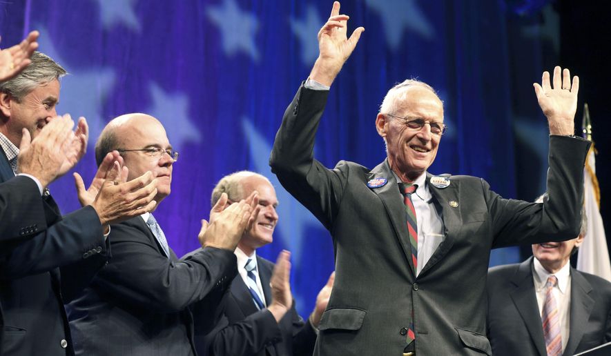 Retiring U.S. Congressman, John Olver, D-Mass., right, gestures to the audience as other members of the state&#x27;s congressional delegation, including from left, John Tierney, Jim McGovern and William Keating, look on during a tribute to Olver at the Democratic State Convention in Springfield, Mass. on Saturday, June 2, 2012. Former U.S. Rep. John Olver, a Democrat who represented western Massachusetts communities for more than two decades in Congress, has died, Thursday, Feb. 23, 2023. He was 86.(AP Photo/Michael Dwyer)