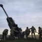 Ukrainian soldiers prepare a U.S.-supplied M777 howitzer to fire at Russian positions in Kherson region, Ukraine, Jan. 9, 2023. Quantifying the toll of Russia’s war in Ukraine remains an elusive goal a year into the conflict. Estimates of the casualties, refugees and economic fallout from the war produce an complete picture of the deaths and suffering. Precise figures may never emerge for some of the categories international organizations are attempting to track. (AP Photo/Libkos, File)