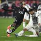 D.C. United forward Christian Benteke, left, and Toronto FC defender Raoul Petretta (28) battle for the ball during the second half of an MLS soccer match, Saturday, Feb. 25, 2023, in Washington. (AP Photo/Nick Wass) **FILE**