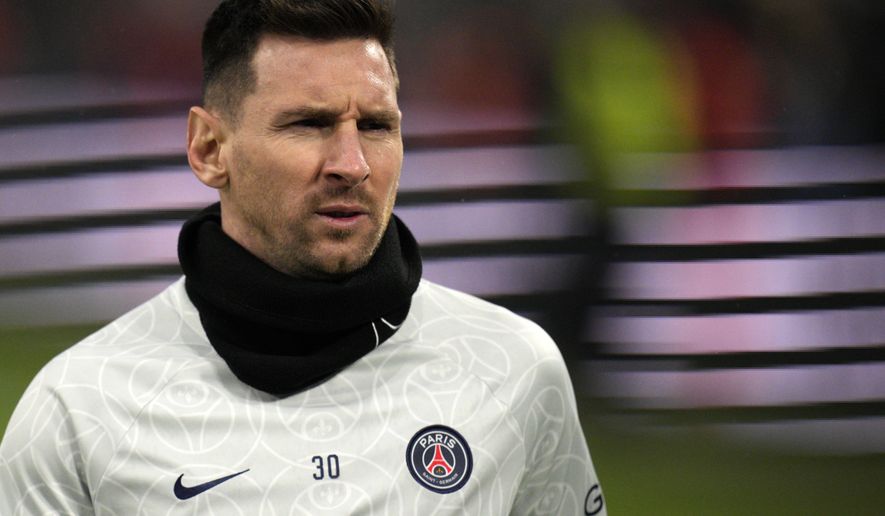 PSG&#x27;s Lionel Messi looks on during warm up before the French League One soccer match between Marseille and Paris Saint-Germain at the Velodrome stadium in Marseille, southern France, Sunday, Feb. 26, 2023. (AP Photo/Daniel Cole)